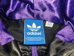 Adidas Originals Chile 62 Wet-Look Kapuzenjacke – Schwarz/Lila/Gold – Gr. S